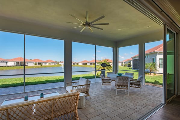 Outdoor patio area with seating overlooking a lake