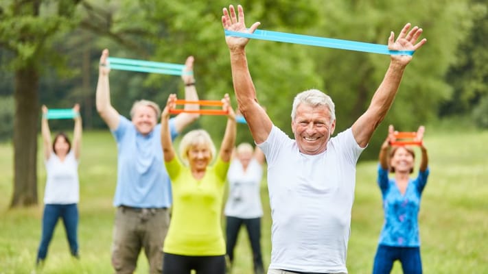 Seniors participating in an outdoor exercise class