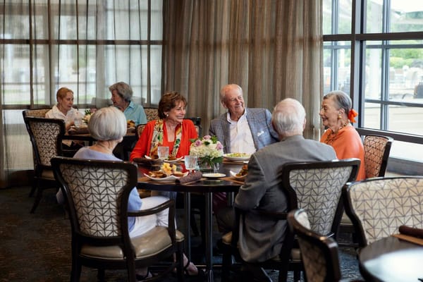 Residents enjoying a meal in the dining room.
