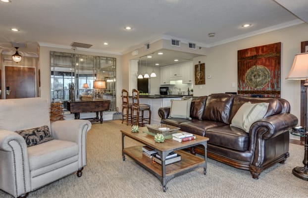 Cozy common area with comfortable seating and kitchen view