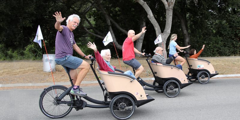 Residents enjoying a cycling activity outdoors