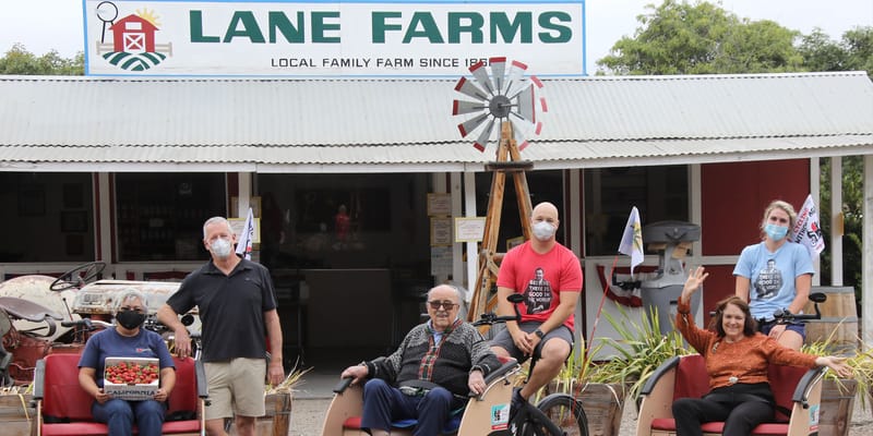 Residents and staff at a farm community event