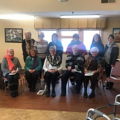 Residents gathered for a group photo in the common area