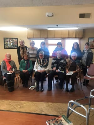 Residents gathered for a group photo in a common area