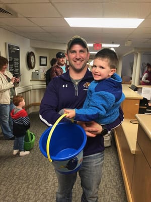 A resident and child participating in an indoor activity