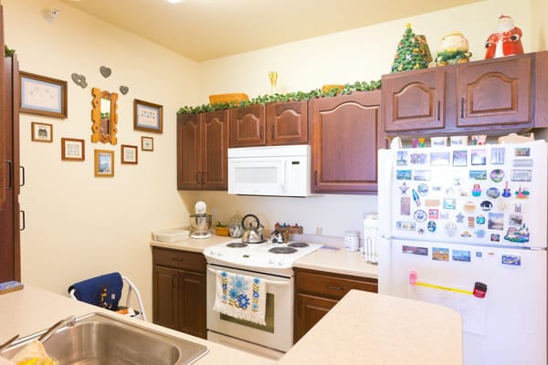 Bright kitchen with cabinets and utensils