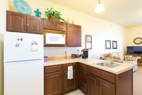 Bright kitchen area in a private resident suite