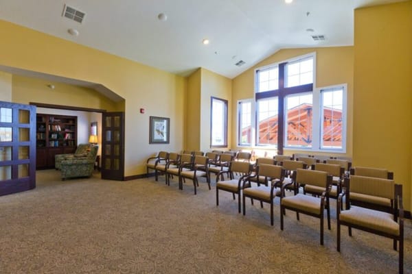 Bright common area with seating and natural light