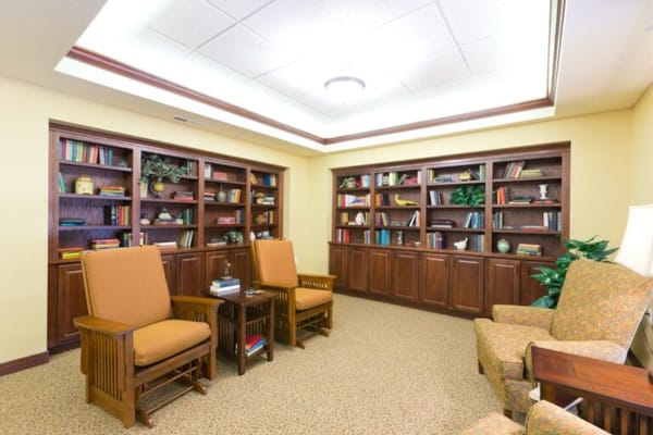 Cozy reading area with bookshelves and seating