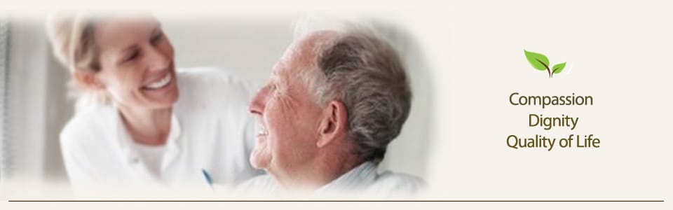 Care staff interacting with a resident in a bright room