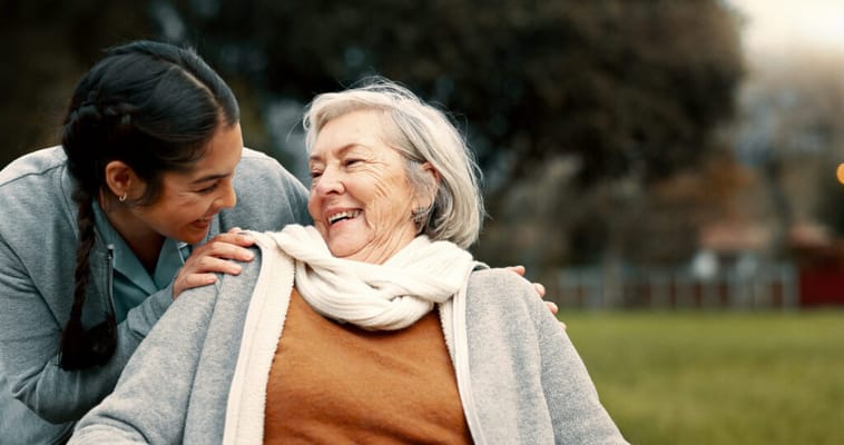 Caregiver and resident enjoying time outdoors together