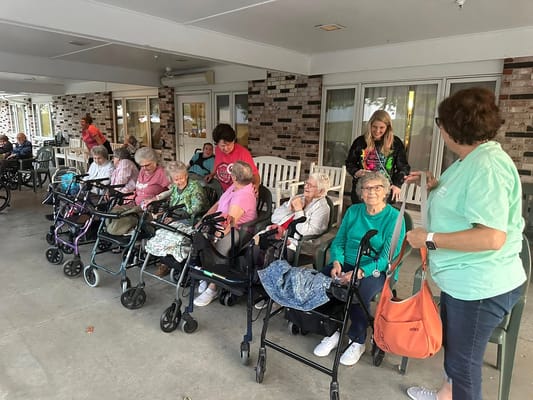 Residents enjoying time outdoors on the porch
