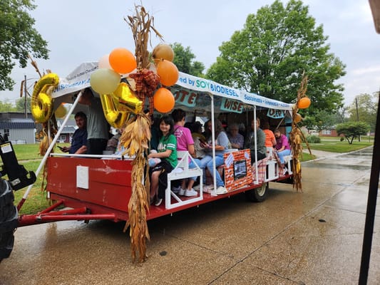 Residents enjoying a decorated hayride at a community event