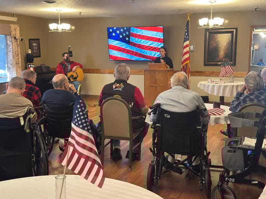 Residents enjoying a patriotic celebration with a speaker
