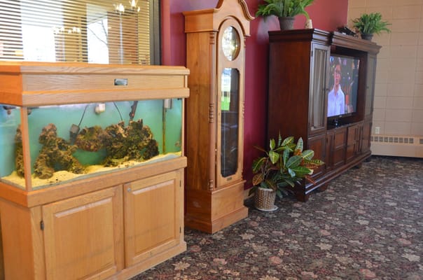 Interior common area with fish tank and furniture