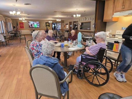Residents engaged in conversation during an activity