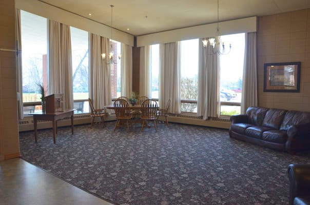Interior common area with seating and large windows