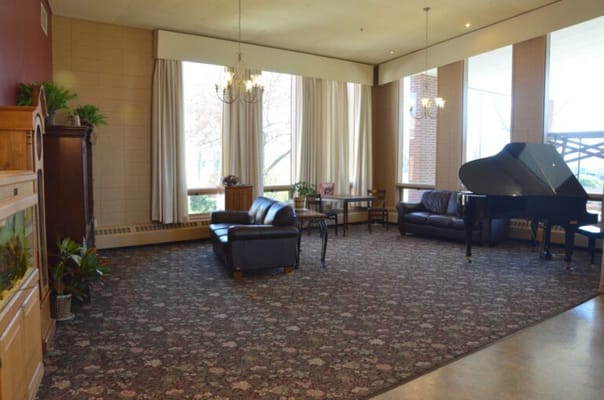 Interior common area with seating and a piano