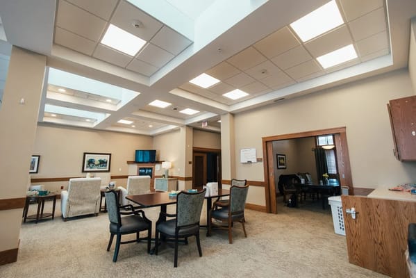 Bright common area with seating and tables