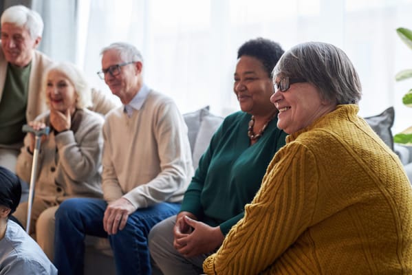 Group of residents enjoying a social activity indoors