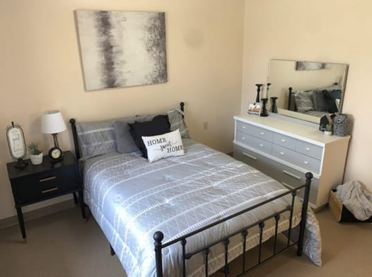 Cozy bedroom with a bed and dresser