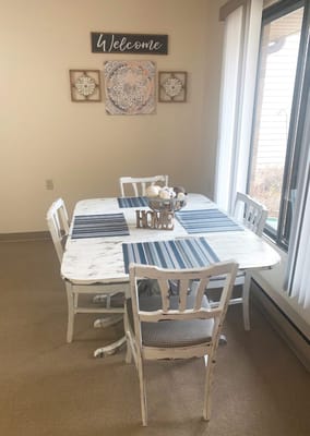 Cozy dining setup with a welcome sign