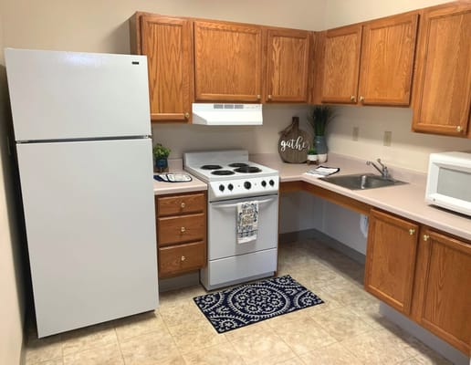 Kitchen area with appliances and cabinets