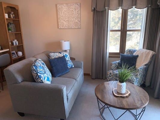 Cozy living room with two chairs and a sofa