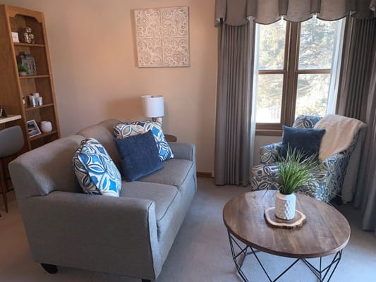 Cozy living room with two chairs and a sofa