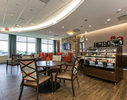 Bright interior of a dining area with tables and chairs