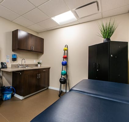 Interior view of a therapy room with exercise equipment
