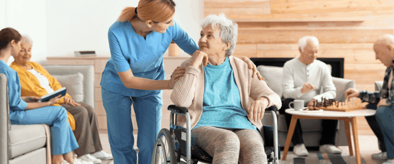 Care staff interacting with a resident in a common area