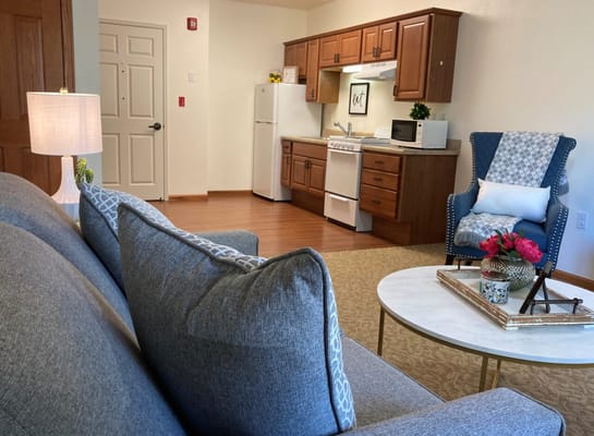Cozy living space with a kitchen area and sitting area
