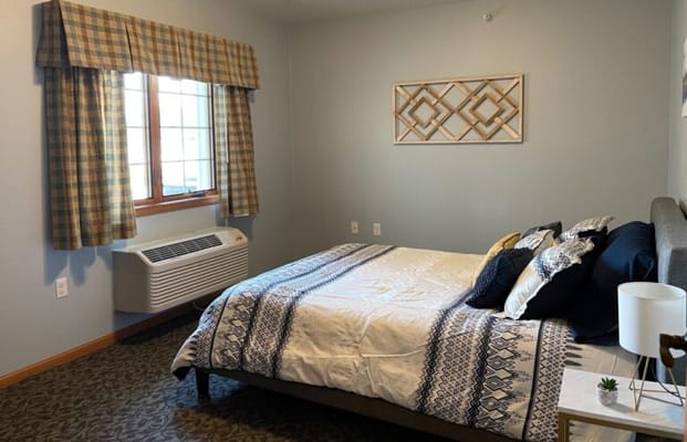 Cozy resident room with a bed and a window