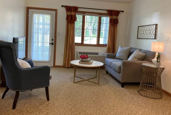 Cozy living area with comfortable seating and natural light