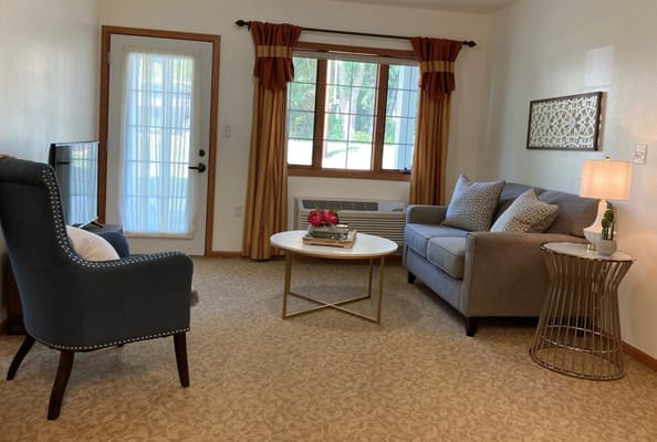 Cozy living area with comfortable seating and natural light