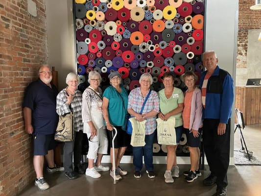 Residents posing together in a vibrant indoor space