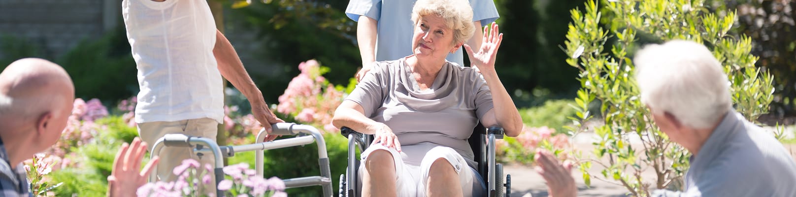 Residents engaging in outdoor activities with staff