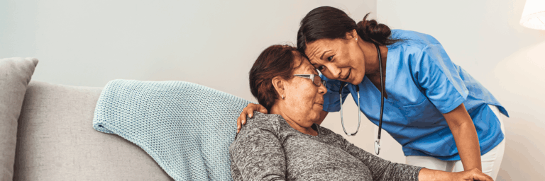 Caregiver interacting warmly with a resident
