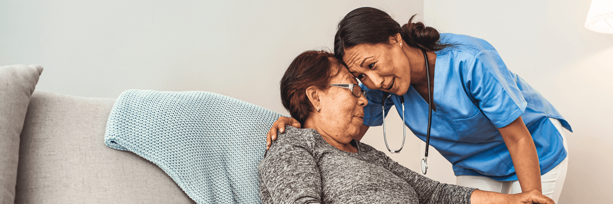 Caregiver interacting warmly with a resident