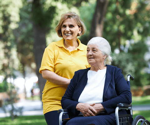 Caregiver assisting a resident in the garden