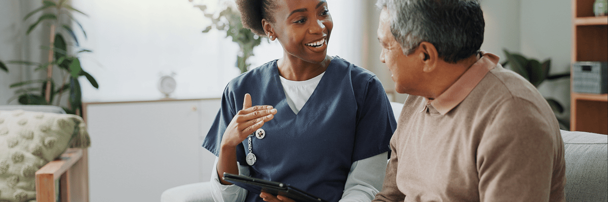 Nurse engaging with a resident in a comfortable setting