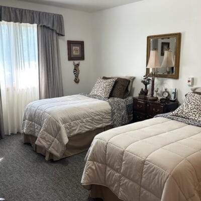 Cozy twin-bedroom setup in assisted living facility