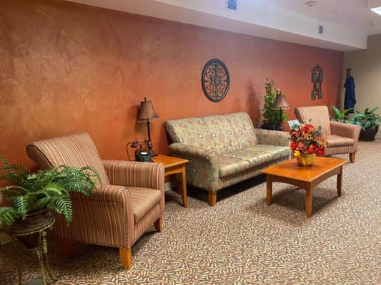 Cozy sitting area with sofas and plants