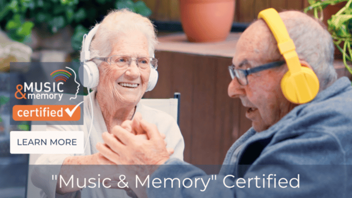 Residents enjoying music therapy with headphones