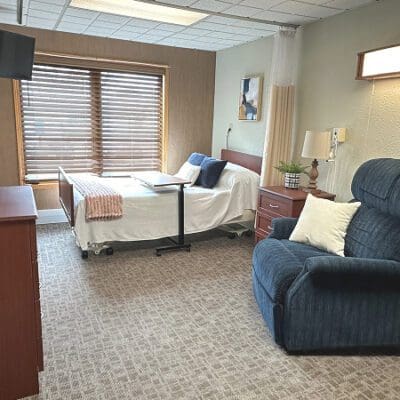 Well-furnished private resident room with comfortable seating