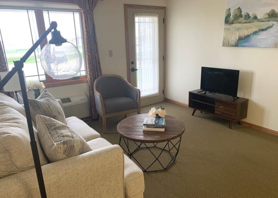 Cozy living room with a sofa and TV