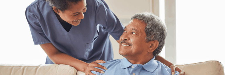 Nurse interacting with a smiling resident