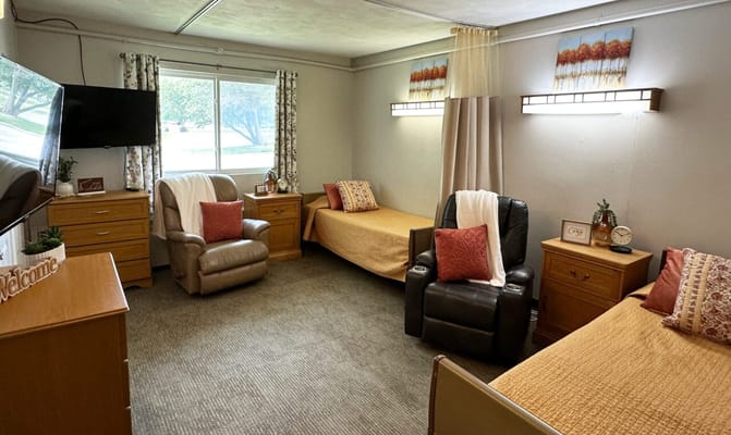 Private resident room with two beds and welcoming decor