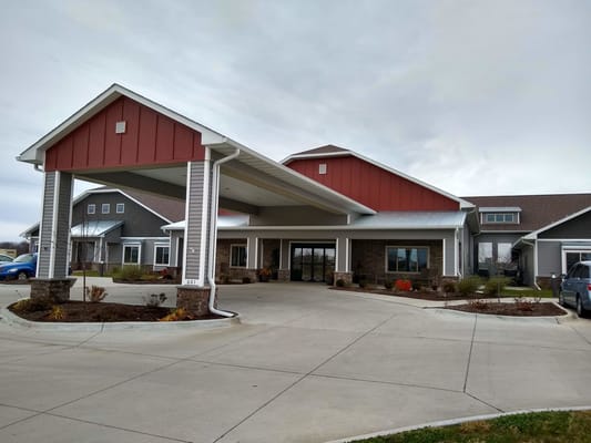 Entrance of a senior living facility with covered drive-thru